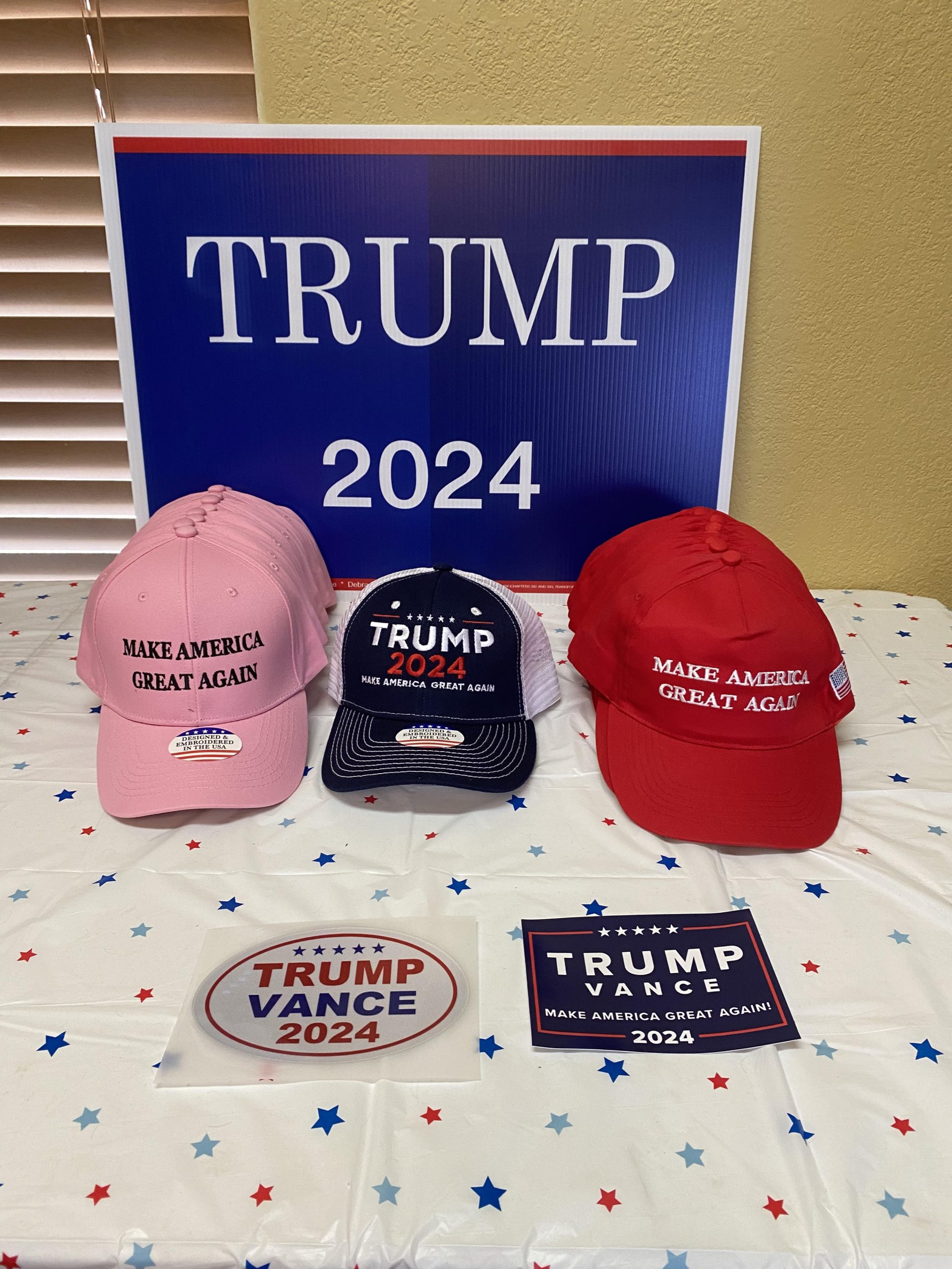 Trump 2024 campaign merchandise including hats and stickers